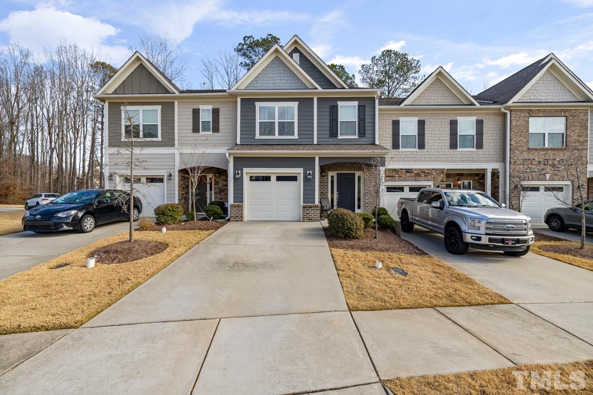 155 Writing Rock Place Apex, NC 27539 - Photo 2 of 33 a view of multiple houses with a outdoor space