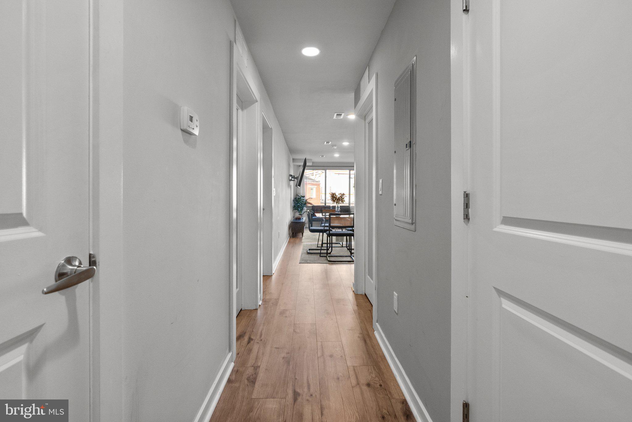 1608 Ridge Avenue, Unit 302 Philadelphia, PA 19130 - Photo 14 of 24 a view of a hallway with wooden floor