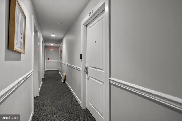 a view of a room with a hallway