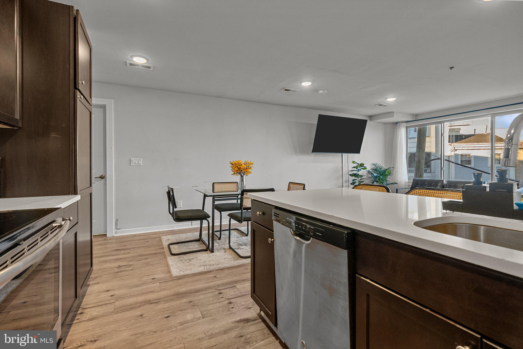 1608 Ridge Avenue, Unit 302 Philadelphia, PA 19130 - Photo 7 of 24 a kitchen with stainless steel appliances granite countertop a sink counter space and cabinets