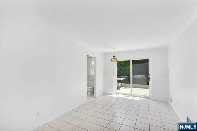 516 Knickerbocker Road Cresskill, NJ 07626 - Photo 4 of 31 an empty room with windows
