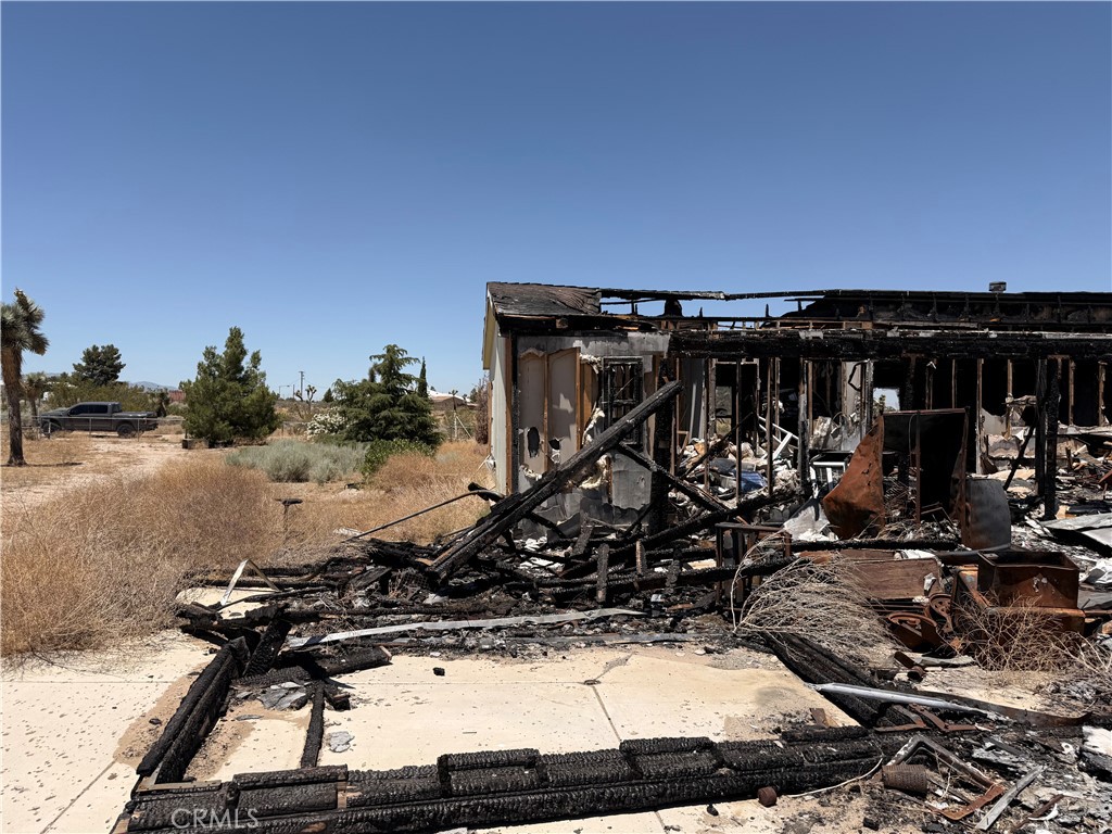 12225 Lager Road Phelan, CA 92371 - Photo 13 of 18 Straight-on view of burned-out back of home