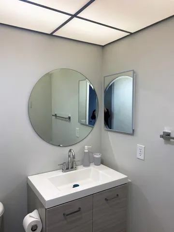 a bathroom with a sink and a mirror