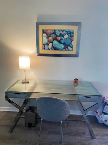 a view of a workspace with furniture