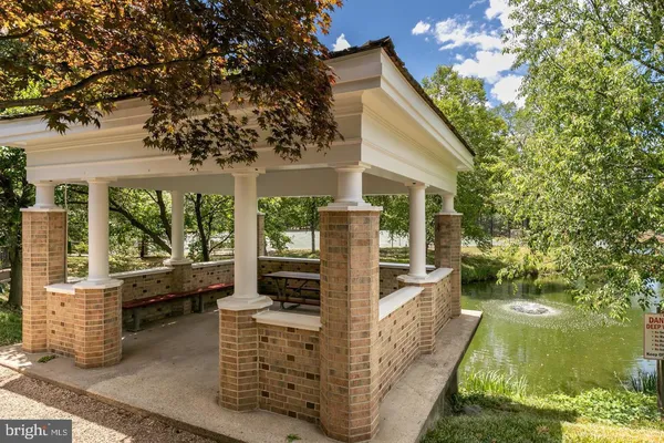 a view of house with backyard