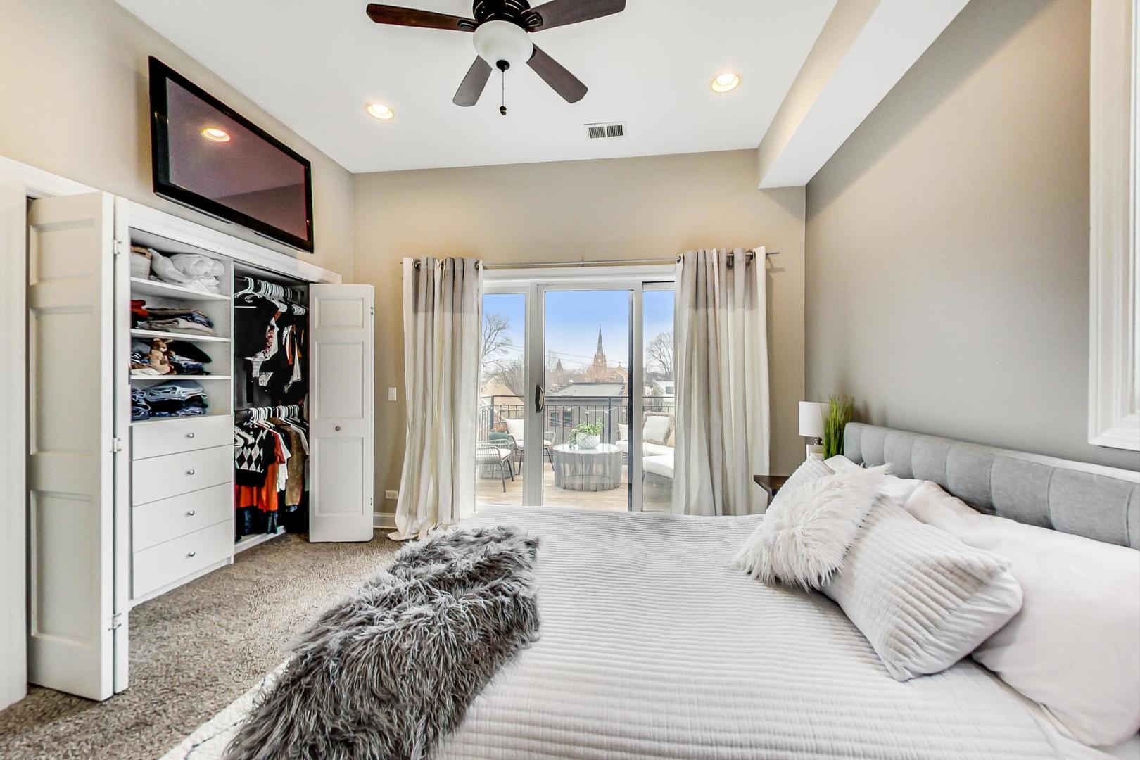3605 South Leavitt Street, Unit 3 Chicago, IL 60609 - Photo 11 of 22 a bed room with a bed and a television