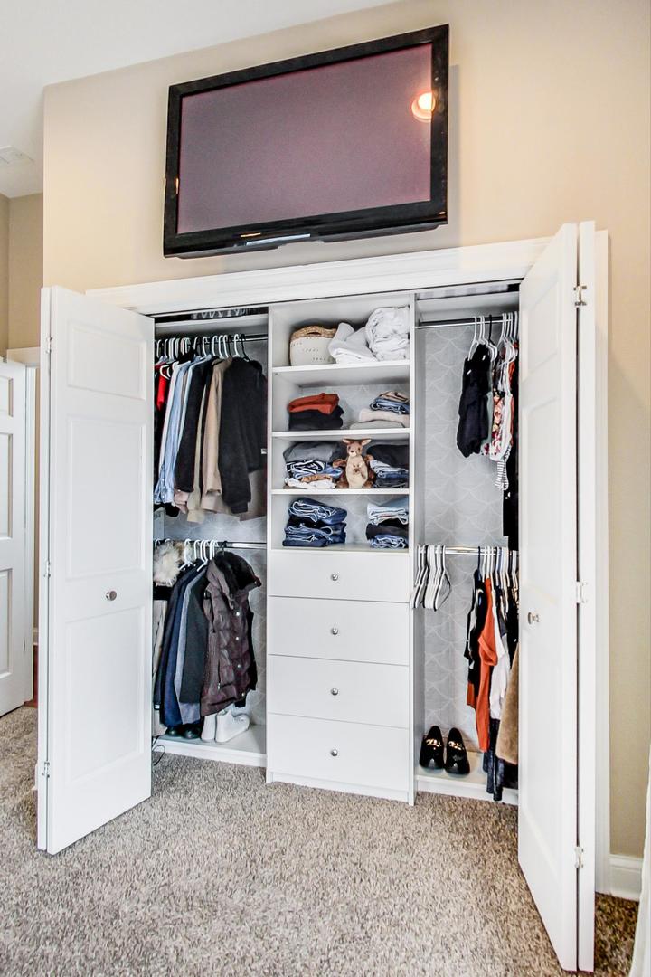 3605 South Leavitt Street, Unit 3 Chicago, IL 60609 - Photo 12 of 22 a view of walk in closet with clothes