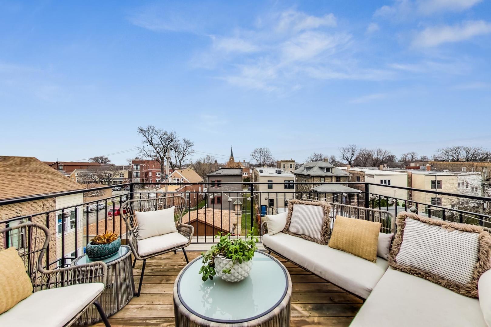 3605 South Leavitt Street, Unit 3 Chicago, IL 60609 - Photo 15 of 22 a balcony with furniture and city view