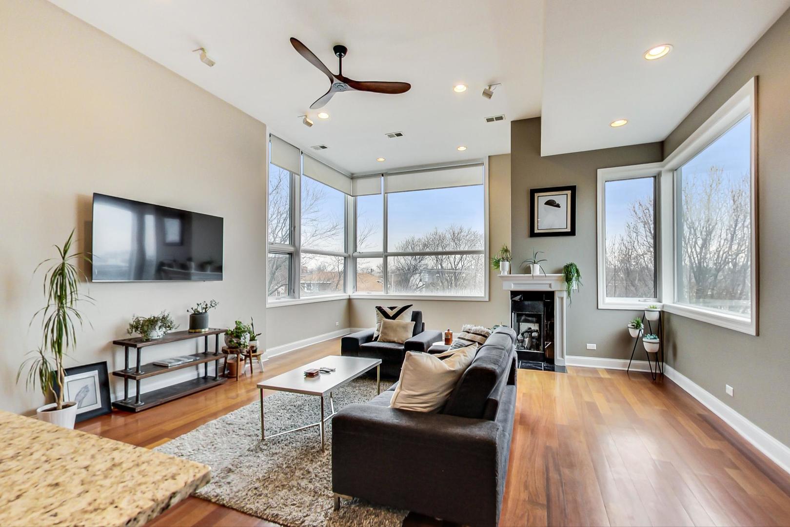 3605 South Leavitt Street, Unit 3 Chicago, IL 60609 - Photo 4 of 22 a living room with fireplace furniture and a flat screen tv
