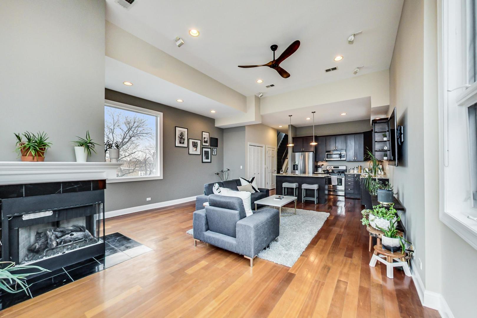 3605 South Leavitt Street, Unit 3 Chicago, IL 60609 - Photo 5 of 22 a living room with furniture and a fireplace