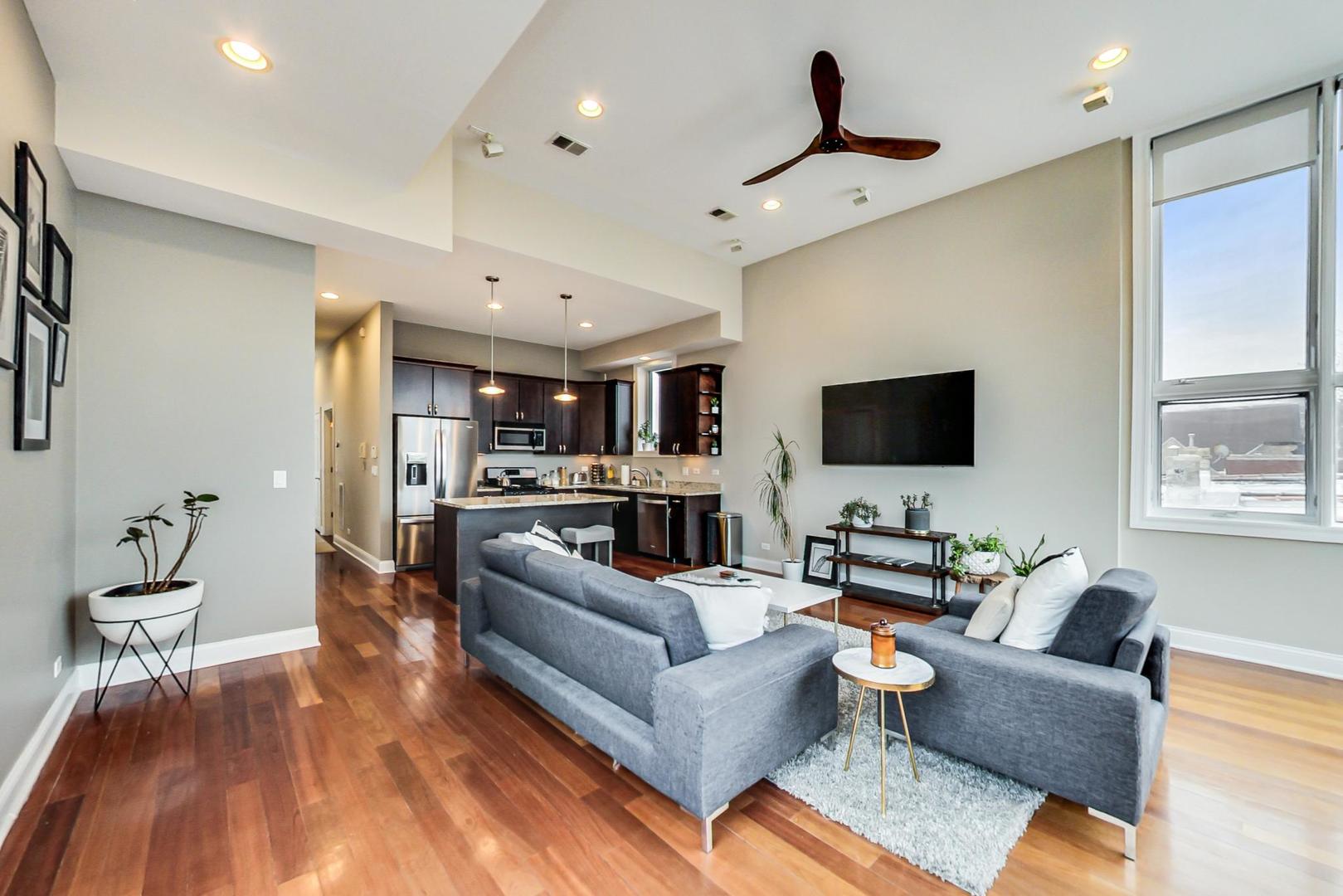 3605 South Leavitt Street, Unit 3 Chicago, IL 60609 - Photo 6 of 22 a living room with furniture and a flat screen tv
