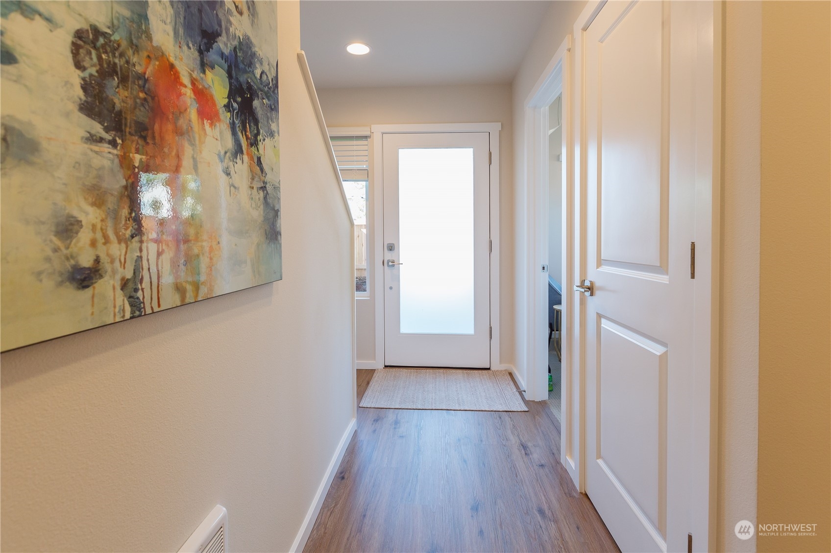 4226 148th Street Southeast, Unit C5 Bothell, WA 98012 - Photo 3 of 24 a view of a hallway with wooden floor and closet