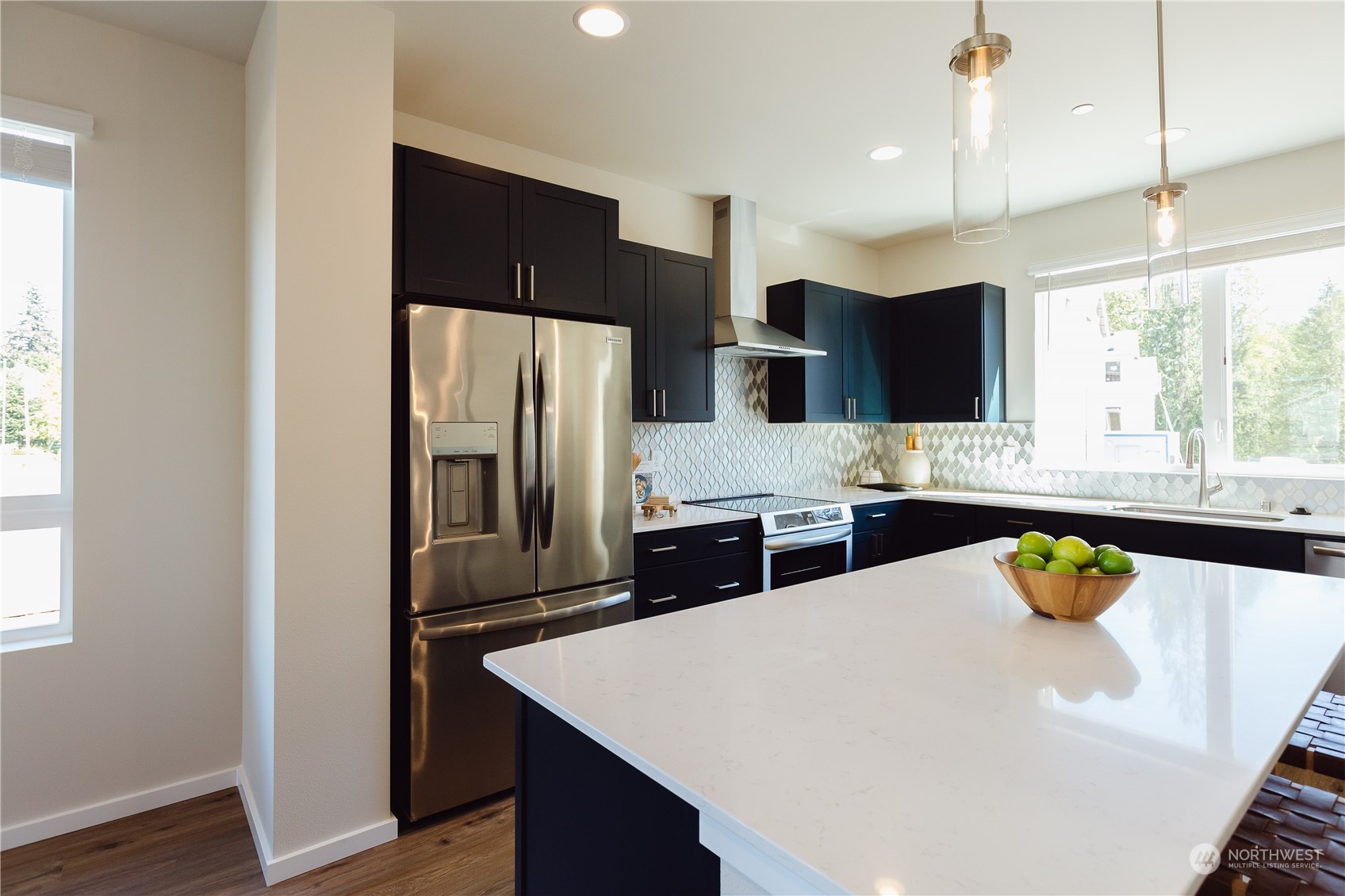 4226 148th Street Southeast, Unit C5 Bothell, WA 98012 - Photo 9 of 24 a kitchen with stainless steel appliances a refrigerator and a sink