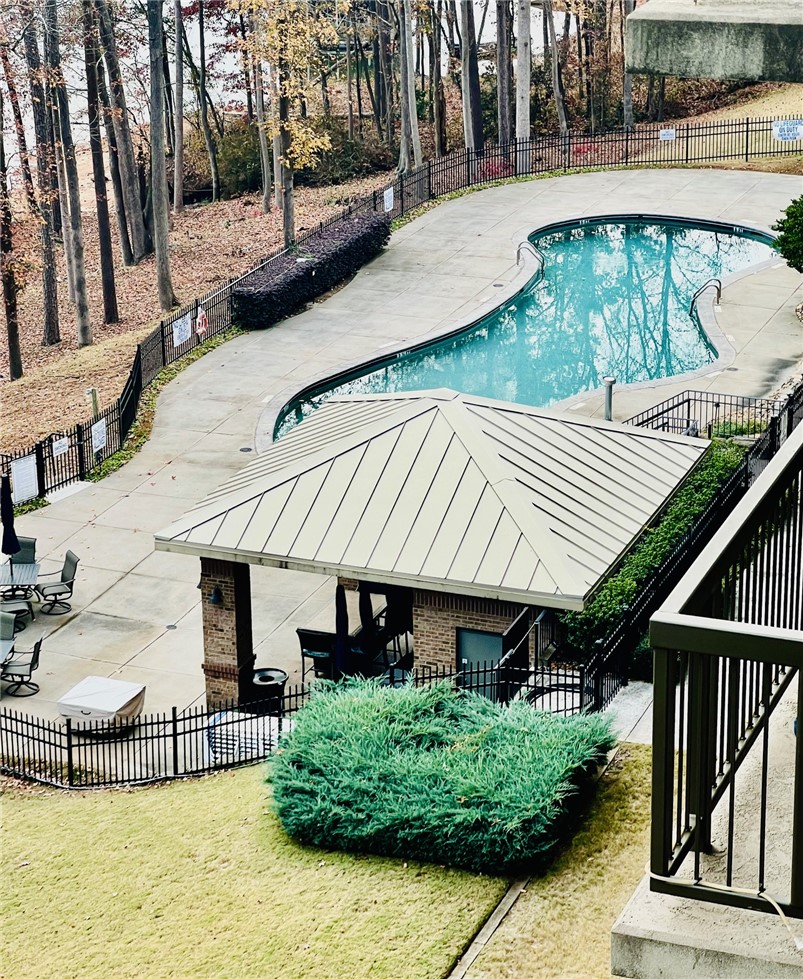 601 Watermarke Lane Anderson, SC 29625 - Photo 20 of 25 An inviting outdoor pool area, perfect for relaxation, is surrounded by lush trees.