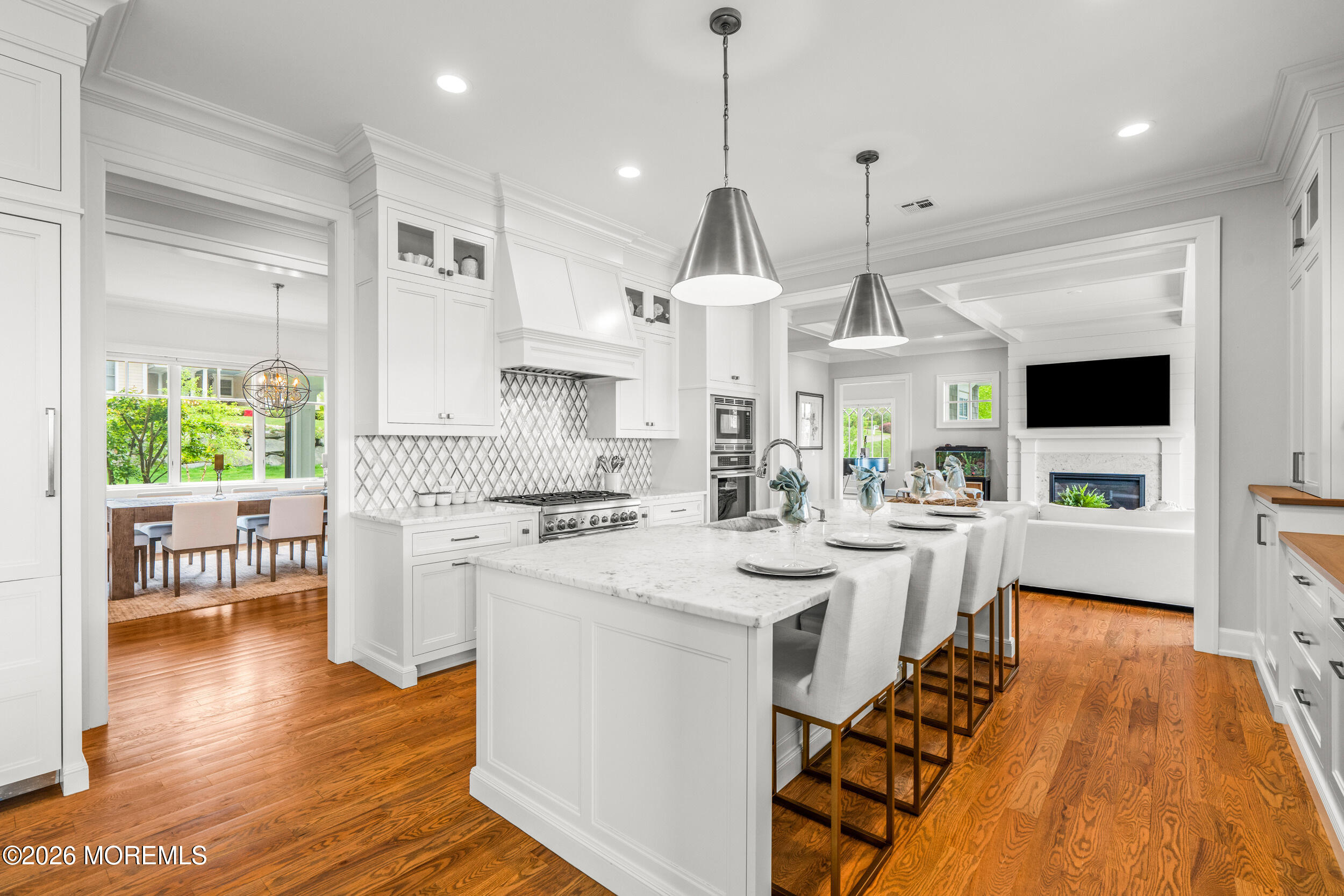 11 Beacon Hill Road Atlantic Highlands, NJ 07716 - Photo 18 of 74 a large kitchen with kitchen island a stove a sink a center island and a wooden floor