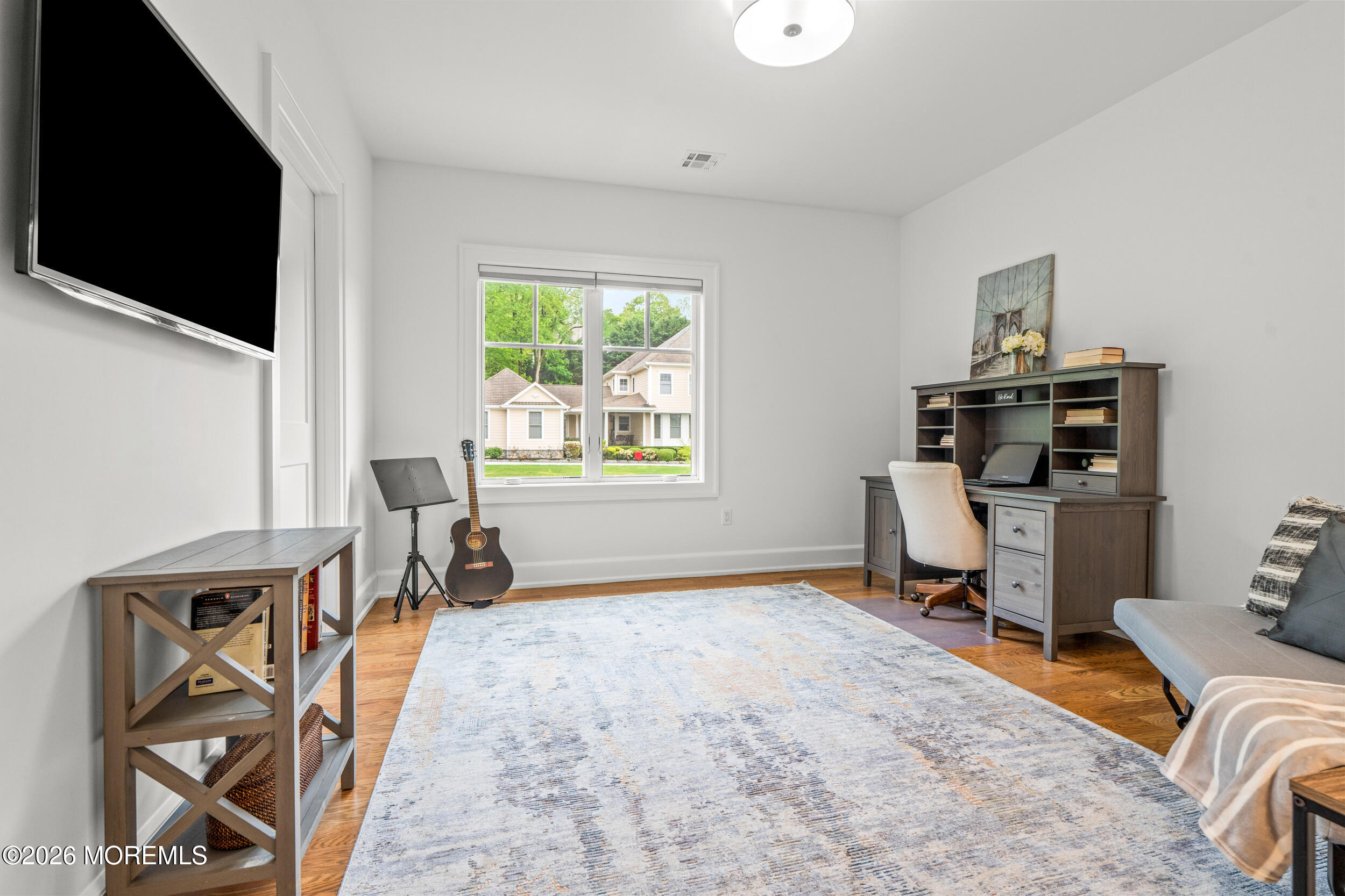 11 Beacon Hill Road Atlantic Highlands, NJ 07716 - Photo 39 of 74 a room with furniture a flat screen tv and a window