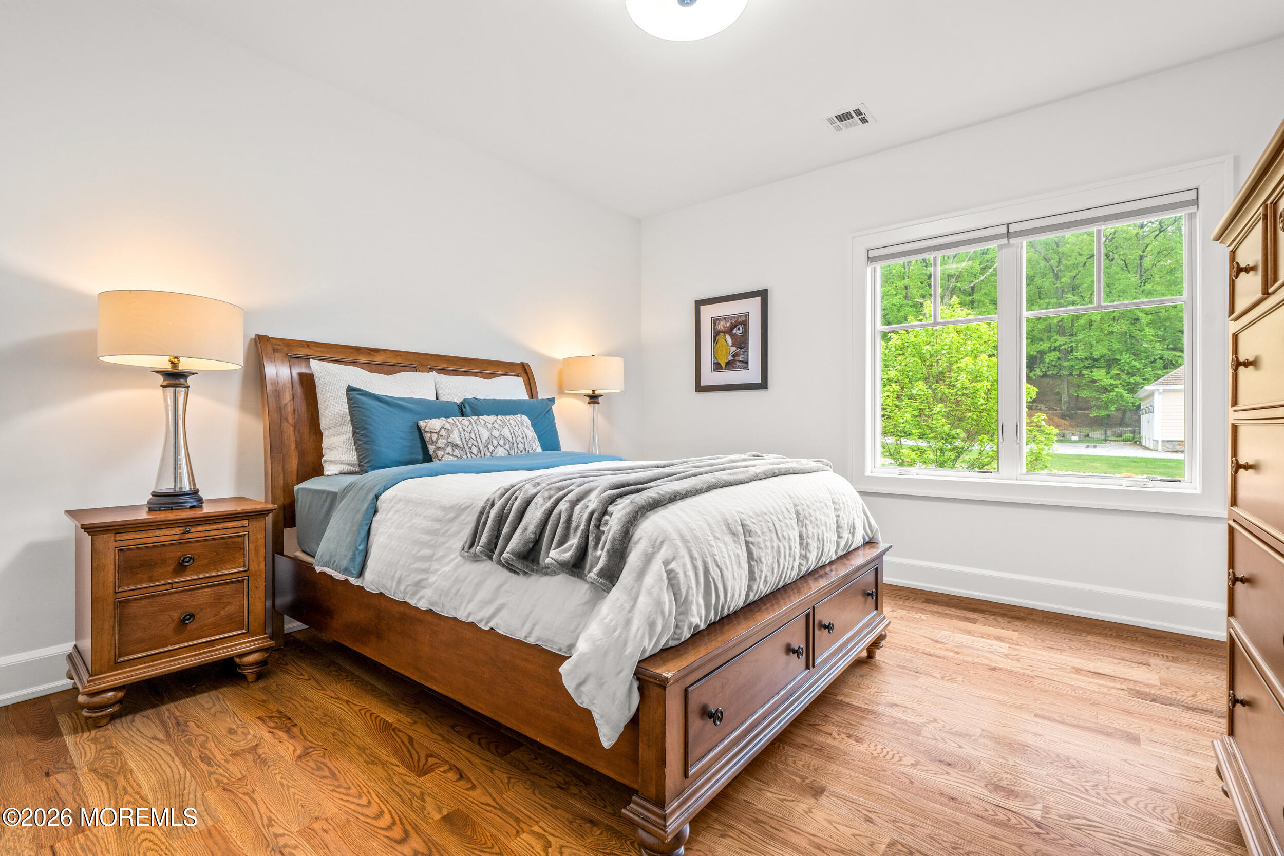 11 Beacon Hill Road Atlantic Highlands, NJ 07716 - Photo 44 of 74 a bed sitting in a bedroom next to a window
