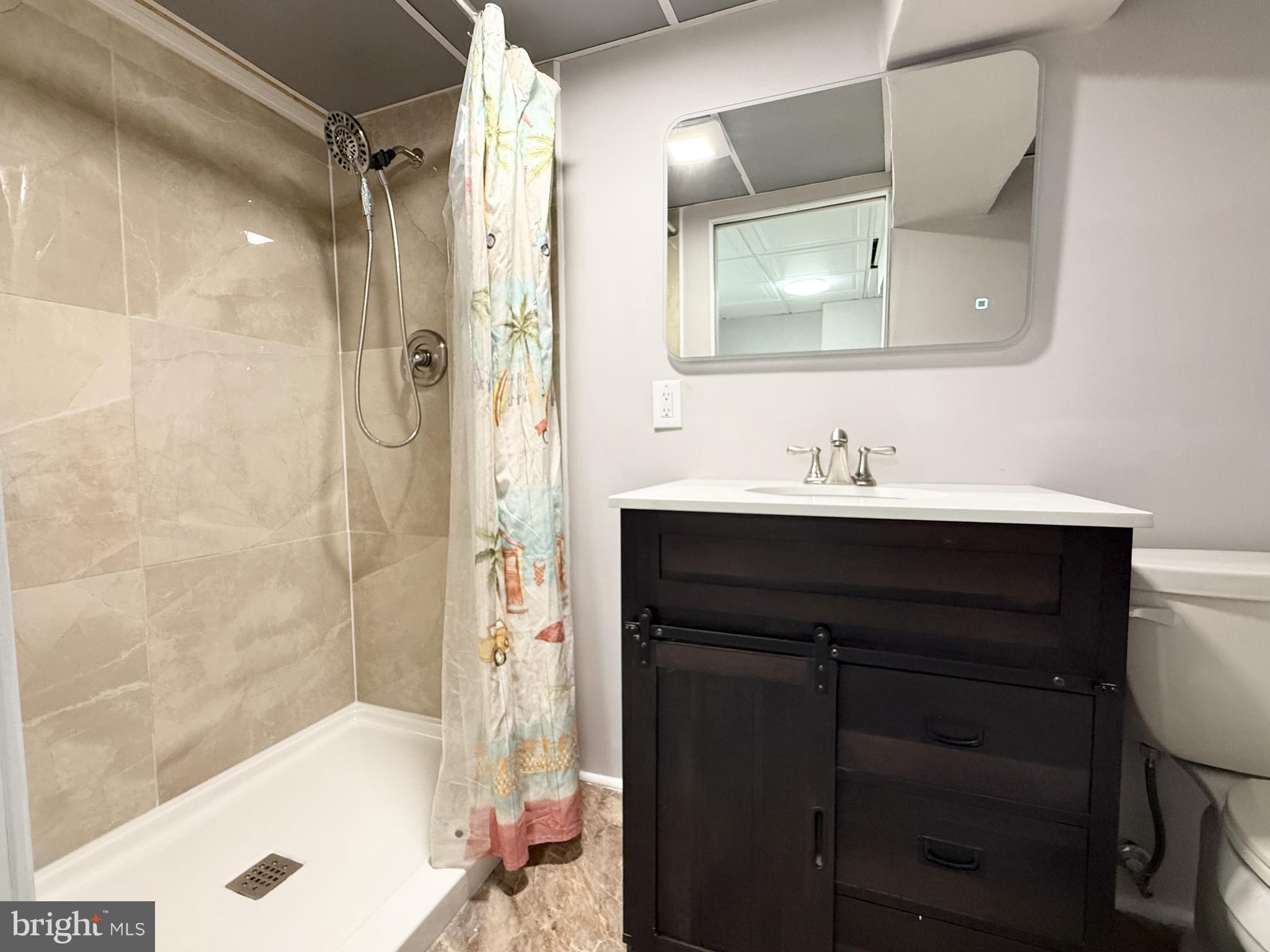 20 Chestnut Drive Elkton, MD 21921 - Photo 26 of 68 a bathroom with a sink and a mirror