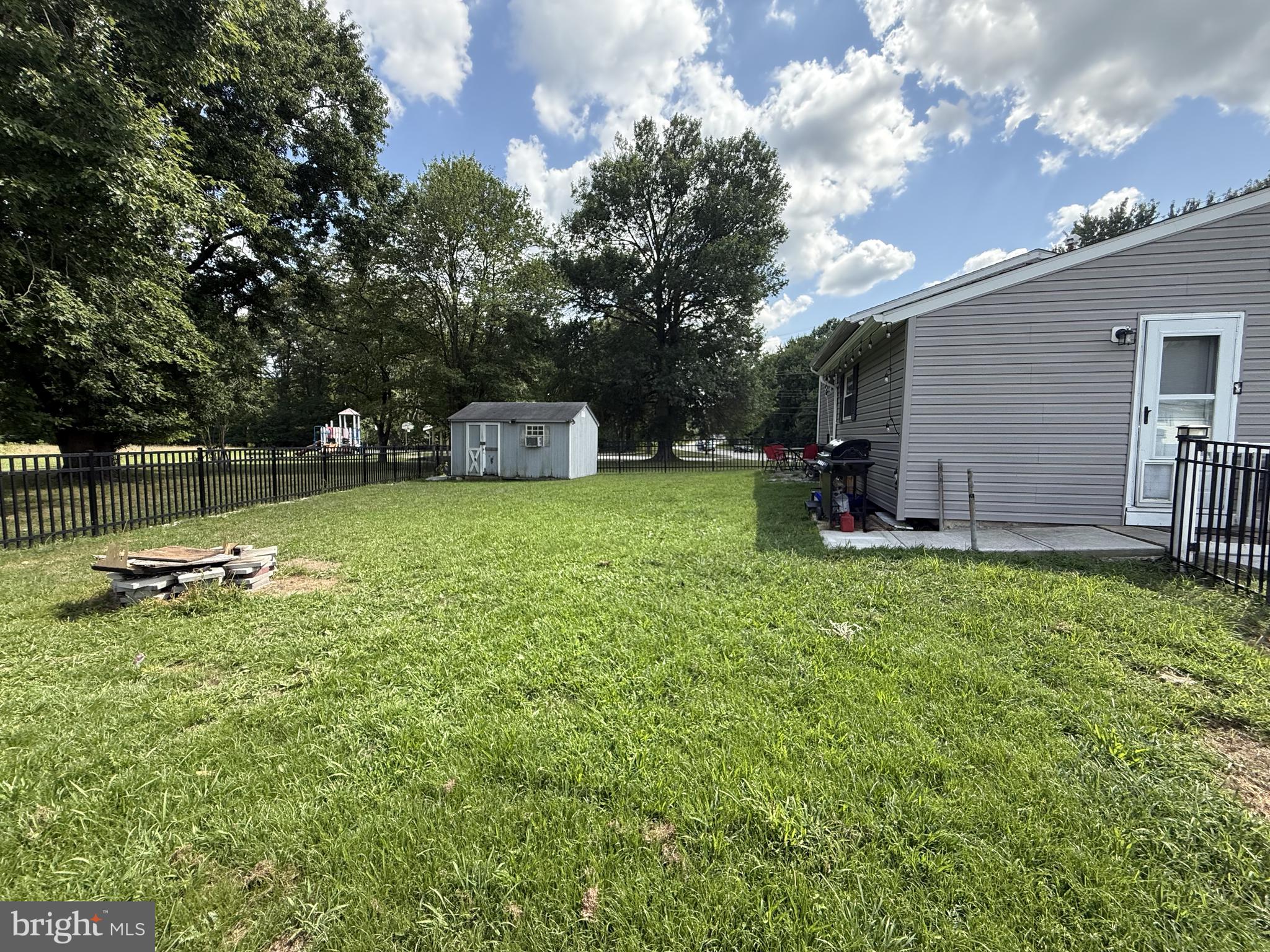 20 Chestnut Drive Elkton, MD 21921 - Photo 49 of 68 a view of a backyard with a garden and fire pit