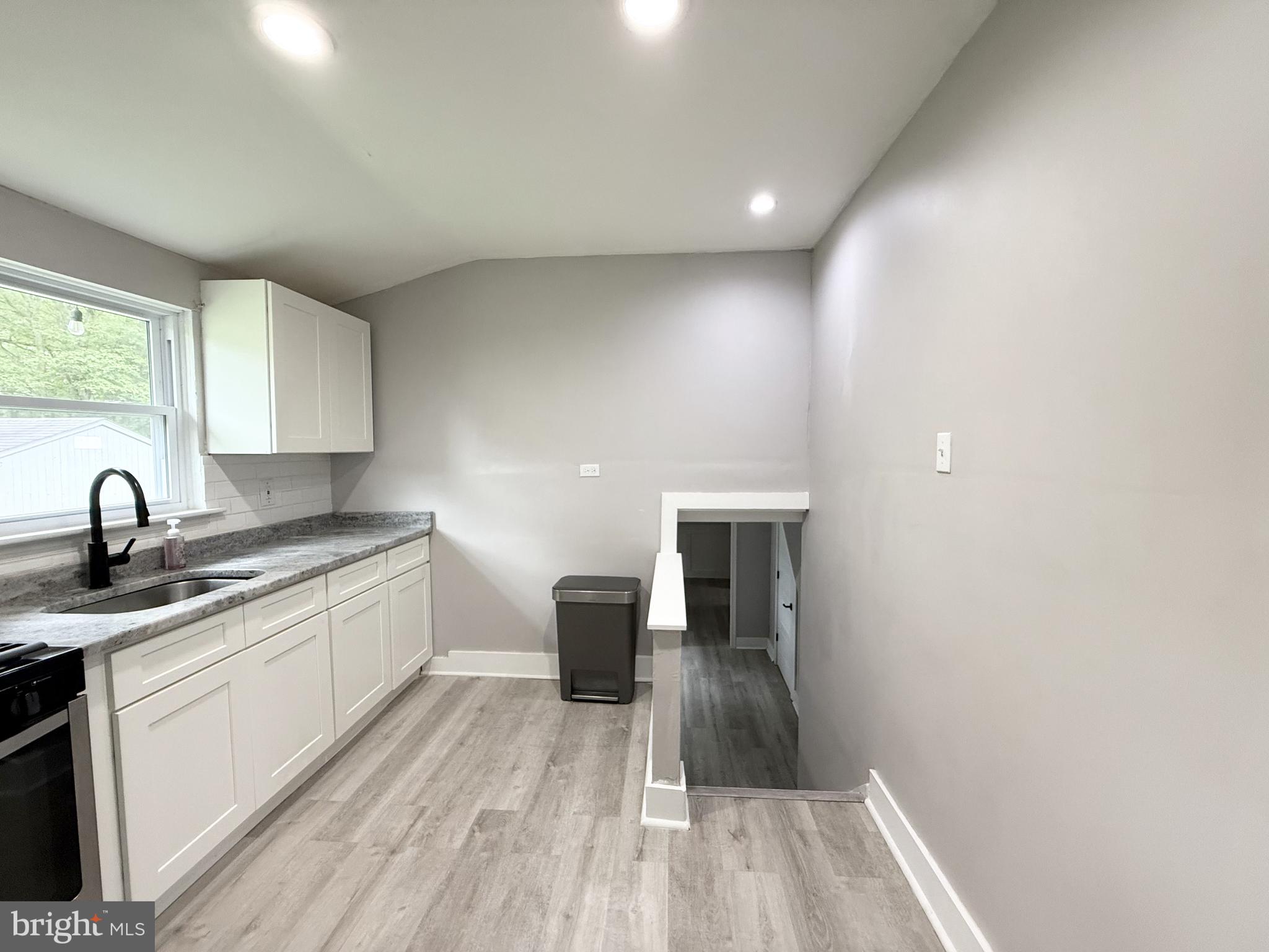 20 Chestnut Drive Elkton, MD 21921 - Photo 7 of 68 a kitchen with a sink and wooden floor