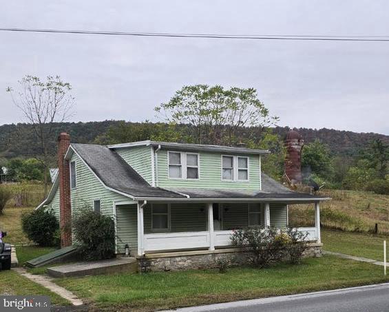 18927 Spring Run Road Dry Run, PA 17220 - Photo 1 of 16 a front view of a house with a garden