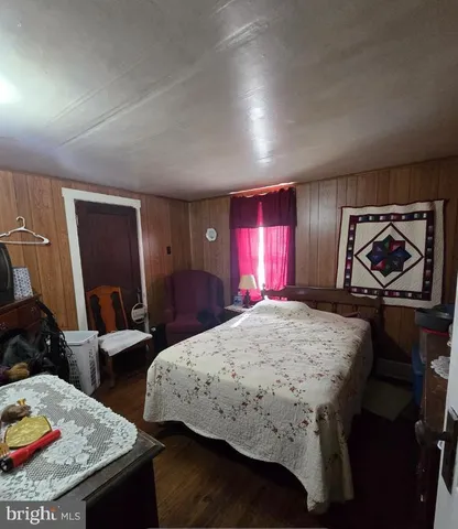 a bedroom with bed and a closet