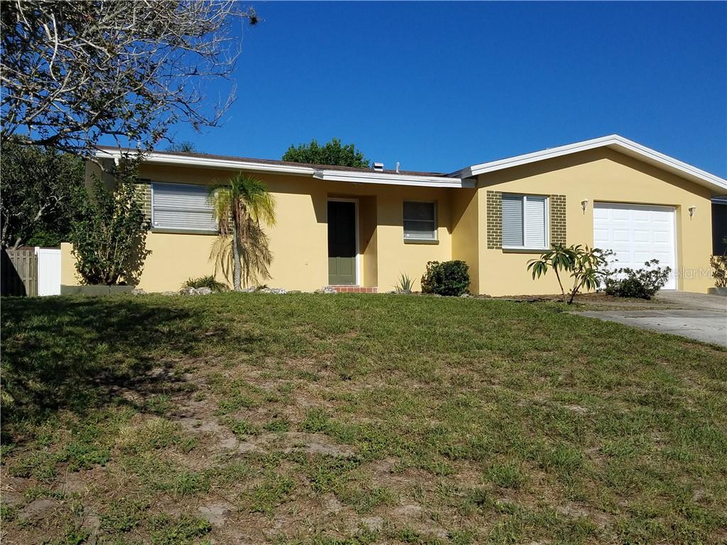 746 Barbara Street Palm Harbor, FL 34684 - Photo 1 of 1 a front view of a house with a yard