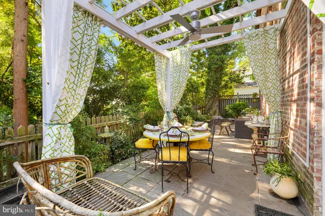 a spacious bedroom with a bed and wooden floor