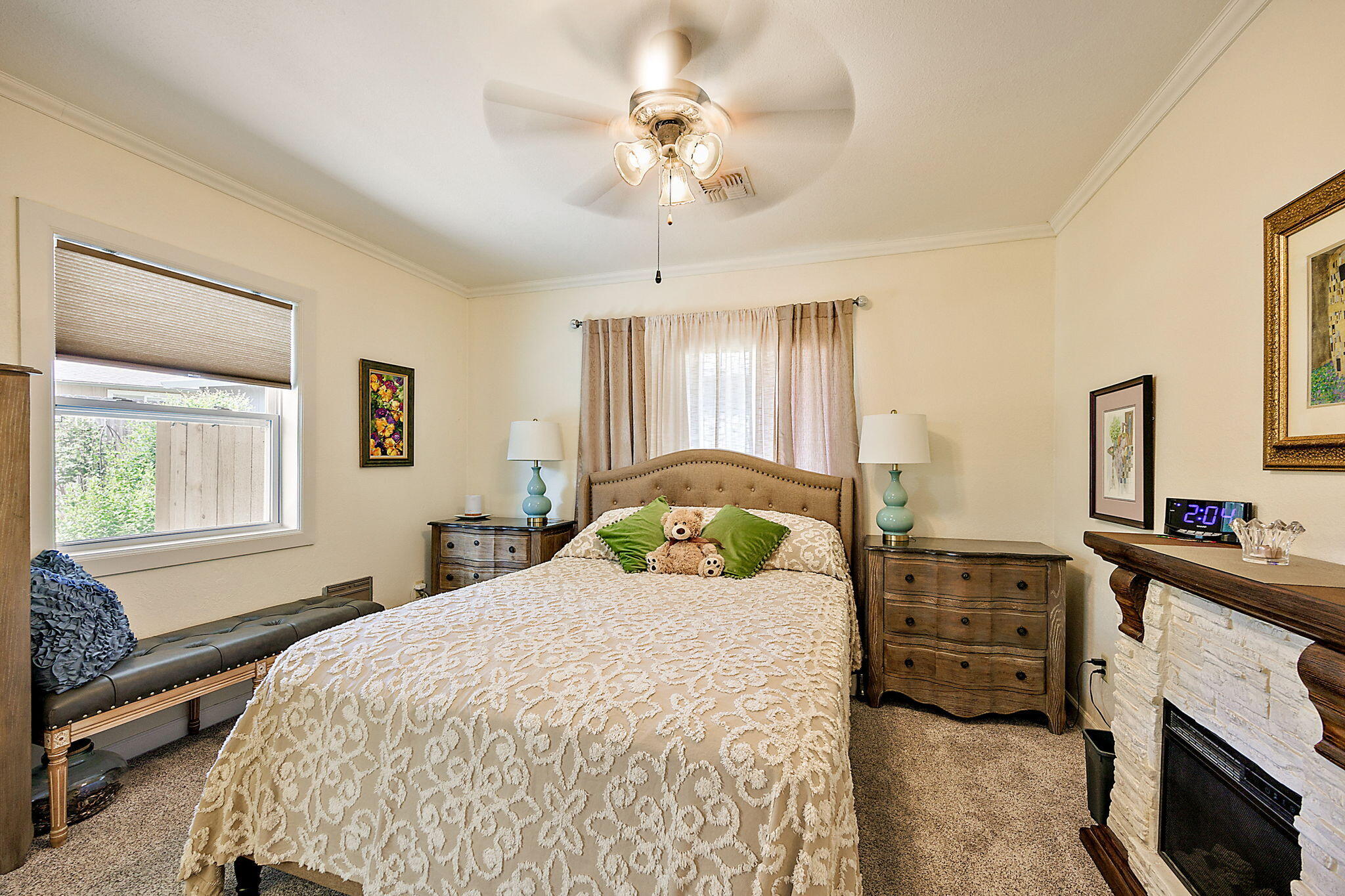 3744 Colver Road Phoenix, OR 97535 - Photo 40 of 58 a bedroom with a bed a chandelier and dresser