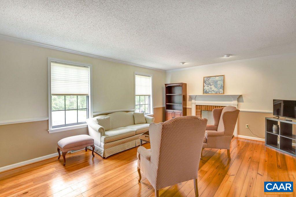 2624 Huntington Road Charlottesville, VA 22901 - Photo 4 of 42 a living room with furniture and a wooden floor