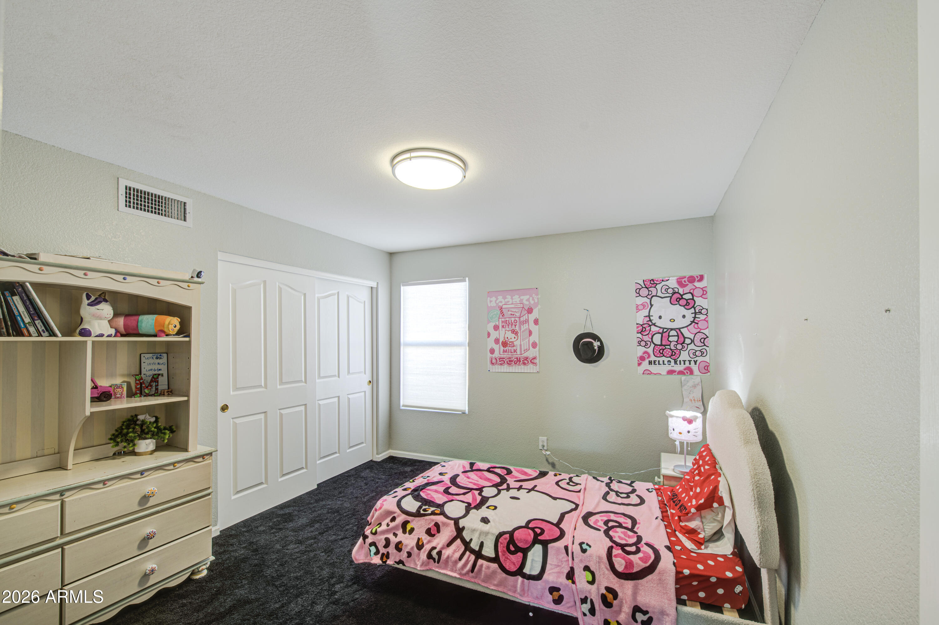 12403 West Monte Vista Road Avondale, AZ 85392 - Photo 36 of 63 a bedroom with a bed and closet