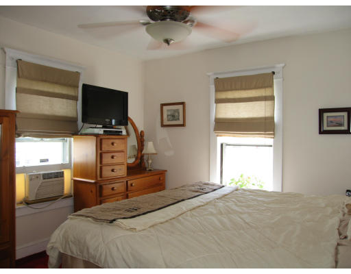 48 David Street Springfield, MA 01104 - Photo 11 of 21 a bedroom with a bed and a flat screen tv