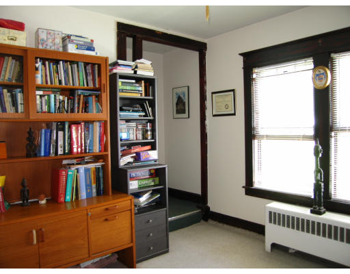 48 David Street Springfield, MA 01104 - Photo 12 of 21 a view of a workspace with bookshelf and a window