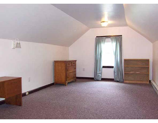 48 David Street Springfield, MA 01104 - Photo 15 of 21 an empty room with windows and cabinet