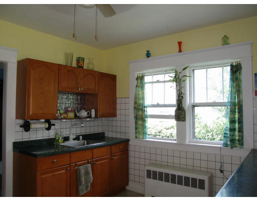 48 David Street Springfield, MA 01104 - Photo 4 of 21 a kitchen with kitchen island granite countertop a sink window and cabinets