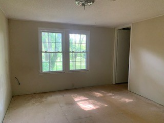 575 Templow Road Bethpage, TN 37022 - Photo 14 of 15 an empty room with windows