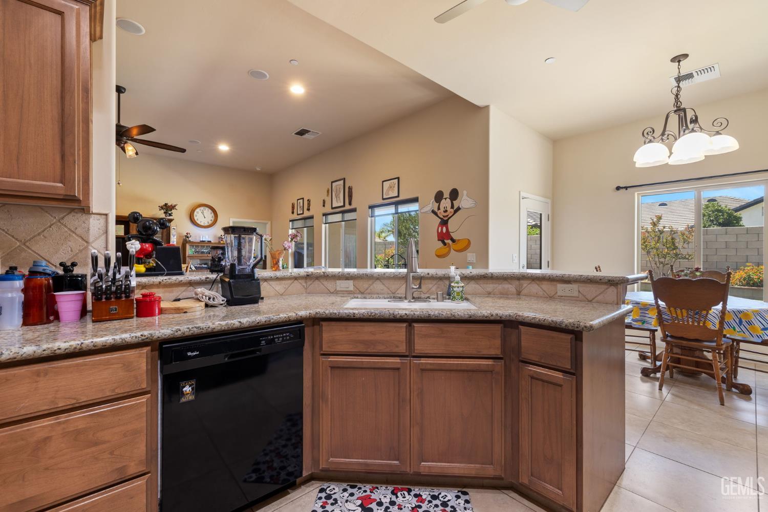 Undisclosed Address Bakersfield, CA 93314 - Photo 15 of 45 a kitchen with a sink and cabinets