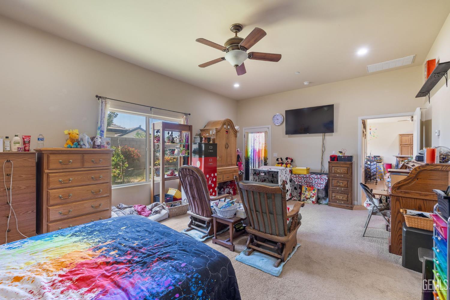 Undisclosed Address Bakersfield, CA 93314 - Photo 19 of 45 a bed room with a bed and a chair