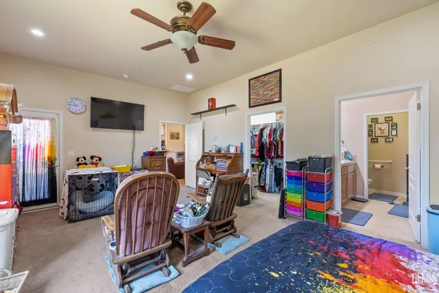 a children room with furniture and a flat screen tv