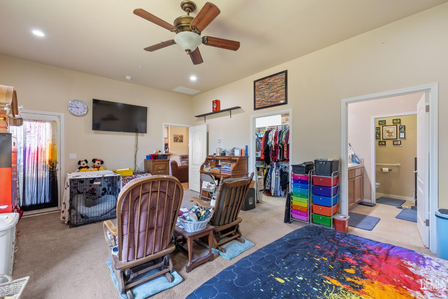 Undisclosed Address Bakersfield, CA 93314 - Photo 20 of 45 a children room with furniture and a flat screen tv