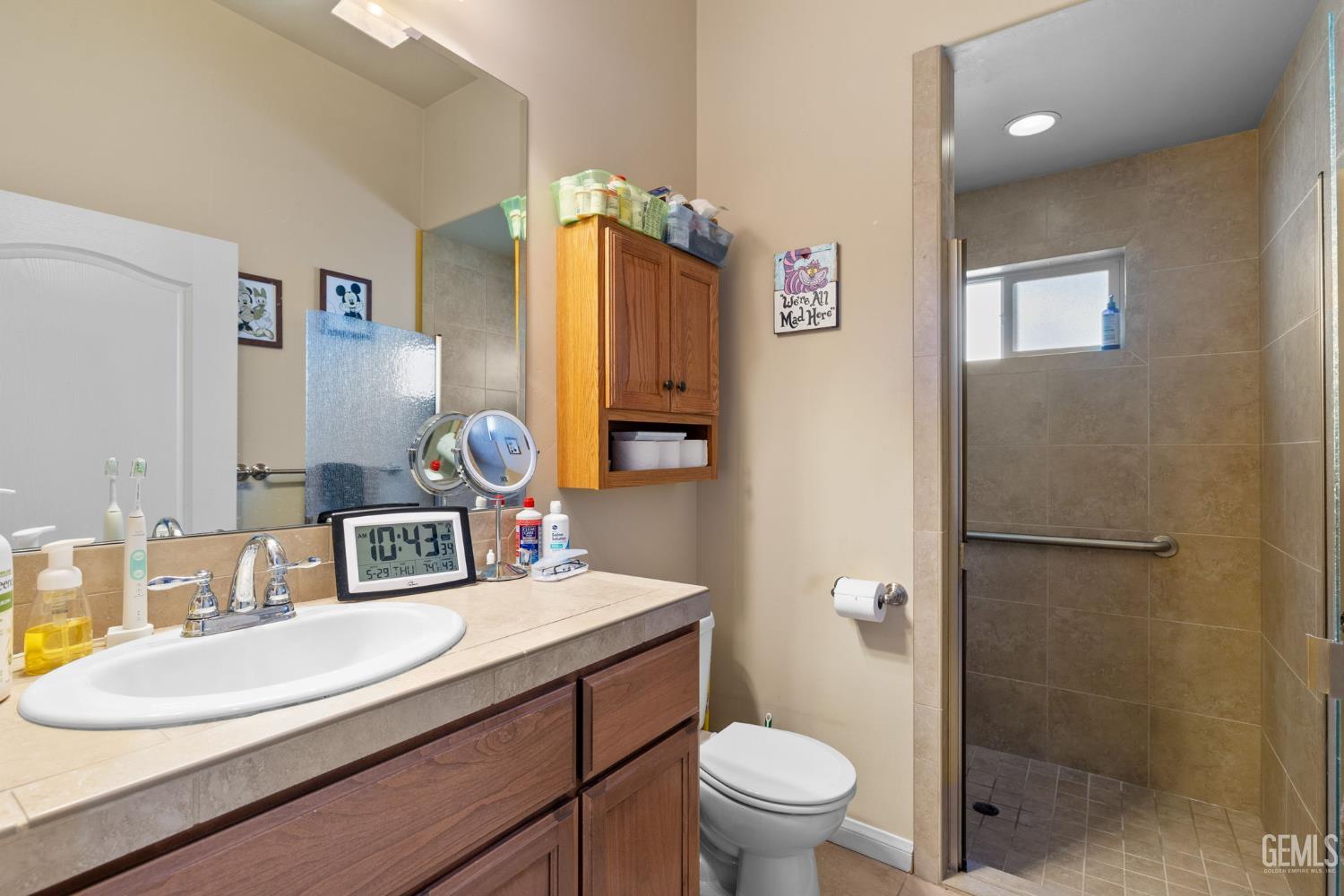 Undisclosed Address Bakersfield, CA 93314 - Photo 30 of 45 a bathroom with a sink toilet and shower