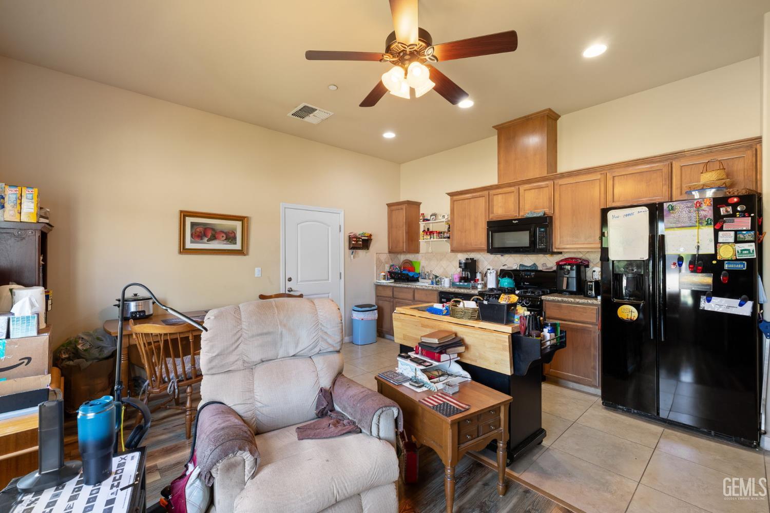 Undisclosed Address Bakersfield, CA 93314 - Photo 33 of 45 a living room with furniture and a flat screen tv