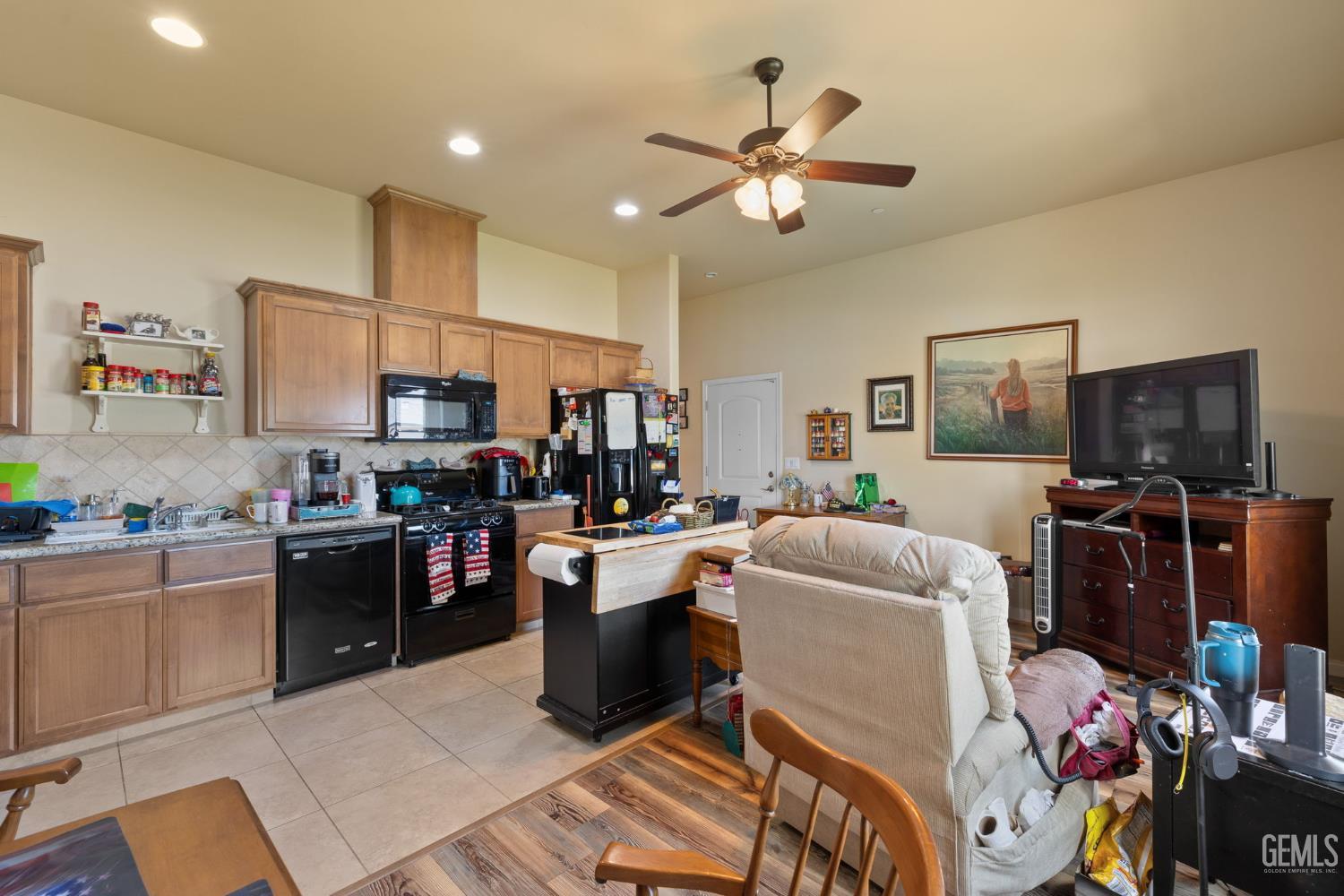 Undisclosed Address Bakersfield, CA 93314 - Photo 35 of 45 a living room with furniture and a flat screen tv