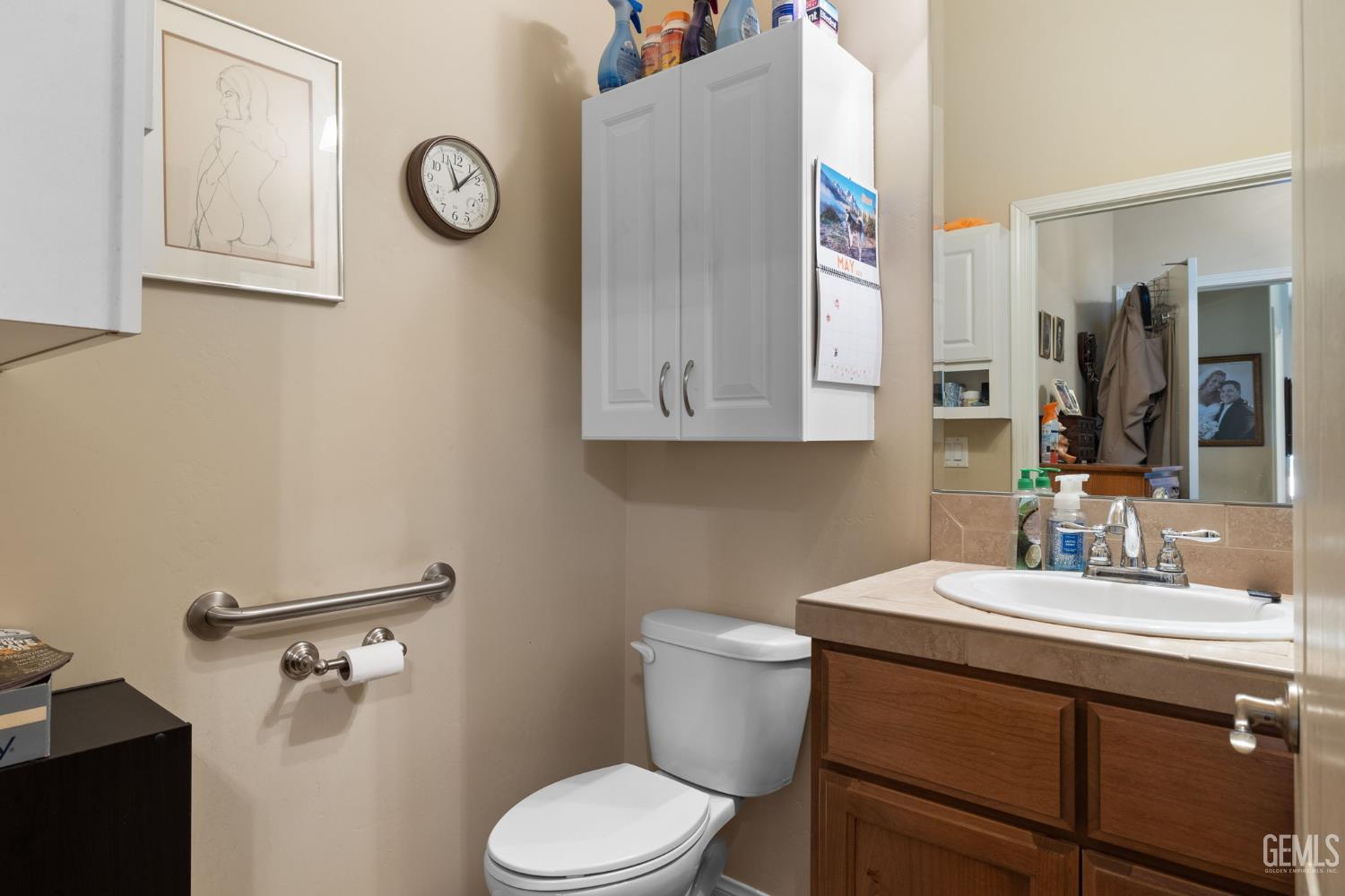 Undisclosed Address Bakersfield, CA 93314 - Photo 37 of 45 a bathroom with a toilet sink vanity and mirror