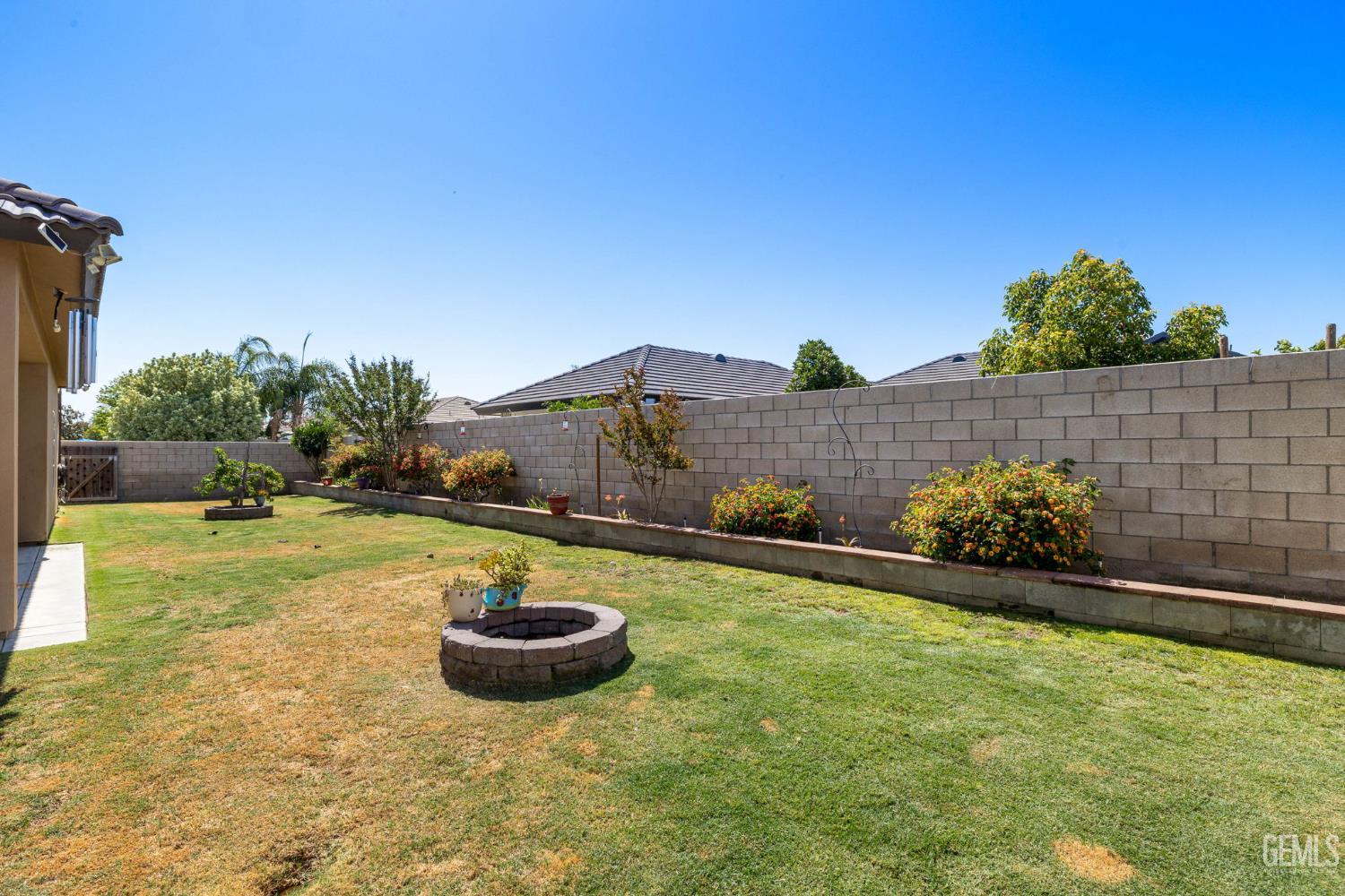 Undisclosed Address Bakersfield, CA 93314 - Photo 41 of 45 a front view of a house with garden