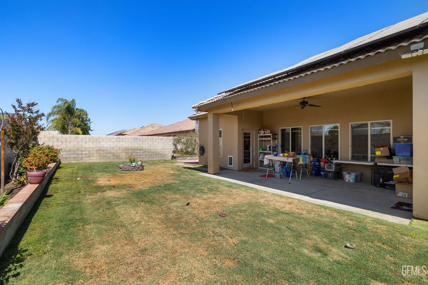 Undisclosed Address Bakersfield, CA 93314 - Photo 45 of 45 a view of a patio with table and chairs and potted plants