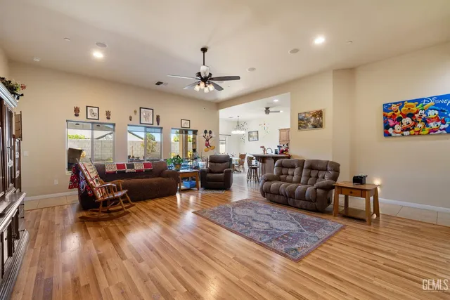 a living room with furniture or couch and a wooden floor