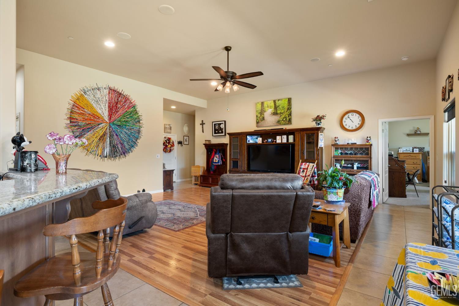 Undisclosed Address Bakersfield, CA 93314 - Photo 8 of 45 a living room with furniture and a flat screen tv