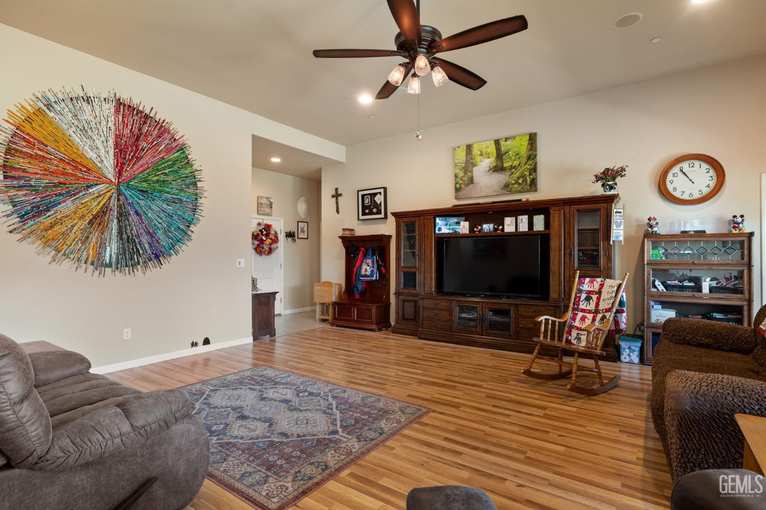 Undisclosed Address Bakersfield, CA 93314 - Photo 9 of 45 a living room with furniture and a flat screen tv