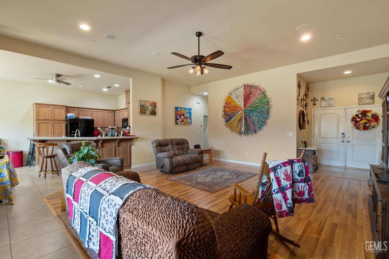 Undisclosed Address Bakersfield, CA 93314 - Photo 10 of 45 a living room with furniture and a flat screen tv